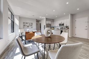 Passaic apartment for rent - A modern dining room with a round table and chairs.