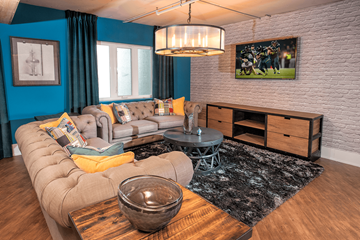 Seattle apartment for rent - A living room with a grey sofa and a wooden coffee table.