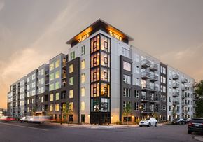 Englewood apartment for rent - a large apartment building on a city street at dusk