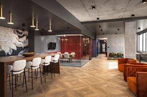 Englewood apartment for rent - a rendering of a lobby with a bar and chairs and a reception area