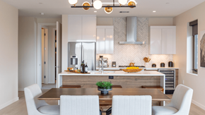 Denver apartment for rent - A modern kitchen with a dining table and chairs.