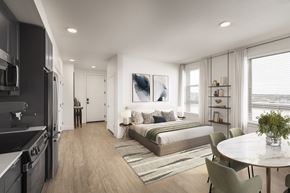 Arvada apartment for rent - A modern kitchen with a dining table and chairs.
