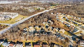Erlanger triplex for rent - A residential area with houses and trees.