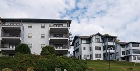 Knoxville apartment for rent - A large white building with a balcony on the second floor.at Maplehurst Apartments, Knoxville Tennessee