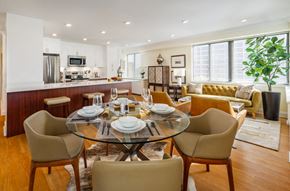 Providence apartment for rent - A modern dining room with a glass table and chairs.
