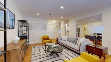 Canton apartment for rent - A living room with a yellow chair and a white couch.