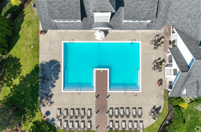 Norwood apartment for rent - An aerial view of a swimming pool surrounded by chairs.