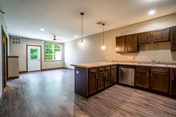 Altoona apartment for rent - A kitchen with wooden cabinets and a dishwasher.