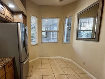 Monrovia condo for rent - A kitchen with a refrigerator, cabinets, and a countertop.