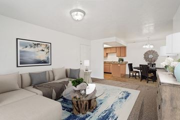 Magna apartment for rent - A living room with a beige couch and a coffee table.
