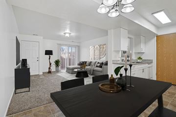Taylorsville apartment for rent - A modern kitchen with a black table and a television.