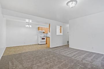 Midvale apartment for rent - A kitchen area with a white oven and a brown rug.