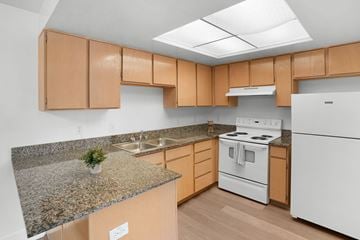 Clinton apartment for rent - A kitchen with a white stove and white refrigerator.