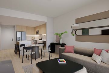 Hallandale apartment for rent - A modern living room with a grey sofa and a black coffee table.