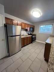 Hyattsville apartment for rent - A kitchen with a refrigerator, microwave, and oven.