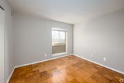 Hyattsville apartment for rent - A room with wooden flooring and a window.