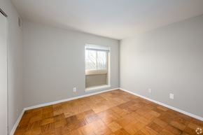 Hyattsville apartment for rent - A room with wooden flooring and a window.