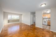 Hyattsville apartment for rent - A room with wooden flooring and a window.