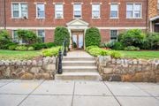 Washington apartment for rent - the front door of a brick building with stairs in front of it