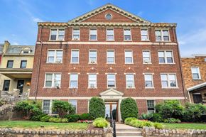 Washington apartment for rent - a large brick building with stairs in front of it