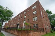 Washington apartment for rent - a large brick building with a sidewalk in front of it