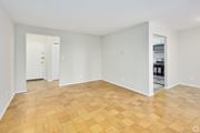 Lanham apartment for rent - Empty room with wooden flooring and white walls.