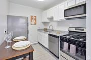Lanham apartment for rent - A kitchen with a stove, oven, and refrigerator.