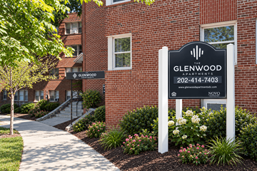 Washington apartment for rent - A sign for Glenwood Apartments is displayed in front of a brick building.