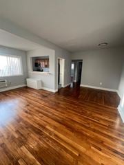 Hyattsville apartment for rent - A room with wooden flooring and a window.