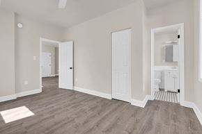 Washington apartment for rent - an empty living room with white walls and a white bathroom