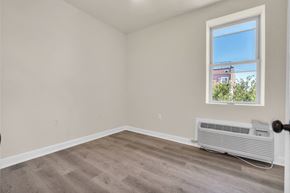 Washington apartment for rent - an empty room with a radiator and a window
