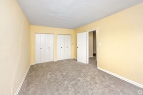 Silver Spring apartment for rent - A room with a carpeted floor and two white doors.