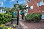 Hyattsville apartment for rent - A brick building with a sign that says "Bloomfield Apartments Leasing Office".