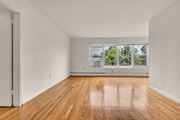 Silver Spring apartment for rent - A room with wooden floors and a large window.