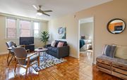 Washington apartment for rent - a living room with a couch and a chair and a tv