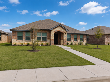 Dallas apartment for rent - A house with a brown roof and a green lawn in front.