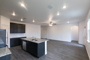 Dallas apartment for rent - A kitchen with a sink and a refrigerator.