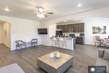 Cleveland apartment for rent - A living room with a grey sofa and a wooden coffee table.