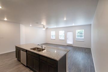 Dallas apartment for rent - A kitchen with a sink and cabinets.