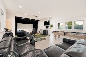 Dallas apartment for rent - A black leather couch in a modern living room.