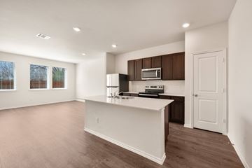 Princeton apartment for rent - A kitchen with a white counter and brown cabinets.