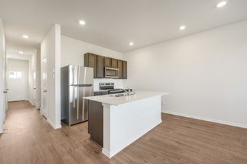 Princeton apartment for rent - A kitchen with a white counter and stainless steel appliances.