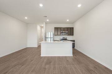 Princeton apartment for rent - A kitchen with a white countertop and wooden flooring.