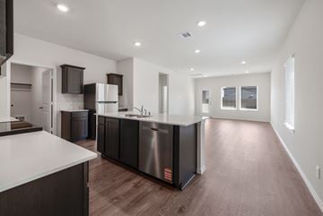 Blue Ridge apartment for rent - A modern kitchen with dark wood cabinets and stainless steel appliances.