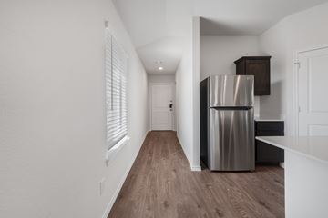 Blue Ridge apartment for rent - A kitchen with a stainless steel refrigerator and wooden flooring.