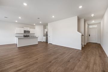 Blue Ridge apartment for rent - A kitchen with white cabinets and a wooden floor.