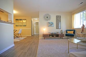 Portsmouth apartment for rent - A living room with a white sofa and a grey coffee table.