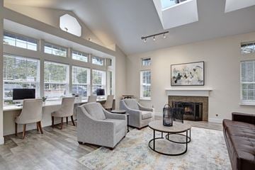 Kent apartment for rent - A living room with a fireplace and a painting on the wall.