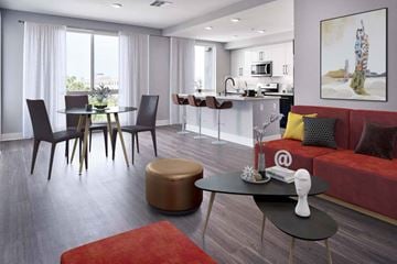 Long Beach apartment for rent - A modern living room with a dining table and chairs.