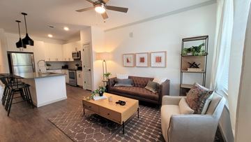 Castle Rock apartment for rent - A living room with a brown couch and a coffee table.